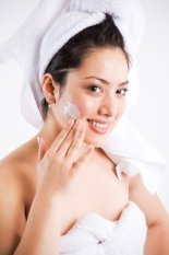 woman applying face cream